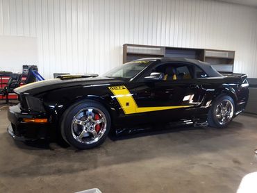 Black mustang convertible. Jack Rouch Jr. racing.