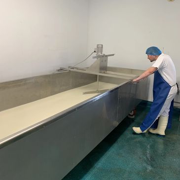 Learn about our artsian cheese making process.