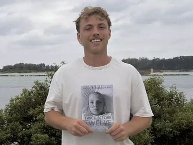 Angus Cunningham with his book Twice Before Twelve as shown in the St George & Sutherland Shire Lead