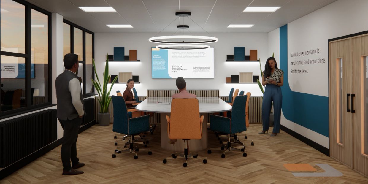 Modern conference room with people engaged in discussion.