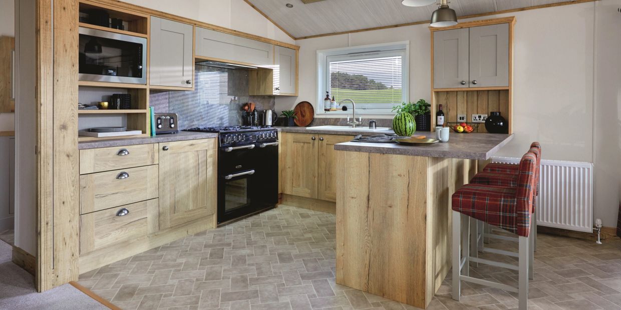 Modern kitchen with wooden cabinetry and a black stove.