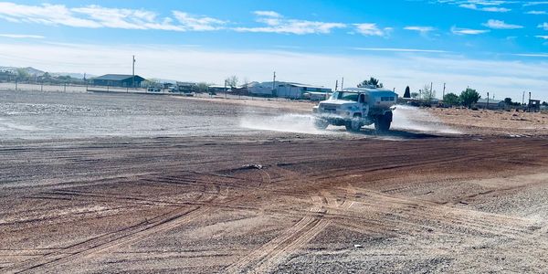 Water truck cleaning the Rv parking lot