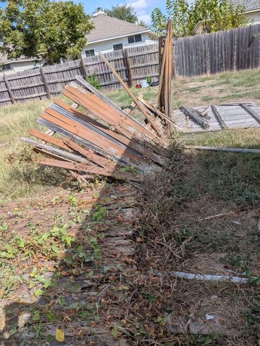Before picture of storm damaged fence in Pflugerville, TX