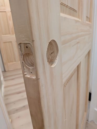 Hung a slab door including mortising.