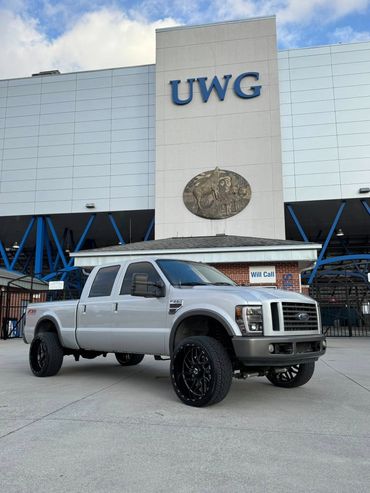 2008 F250 6.4l in for a simple leveling kit, 24x12 on 305 street tires. 