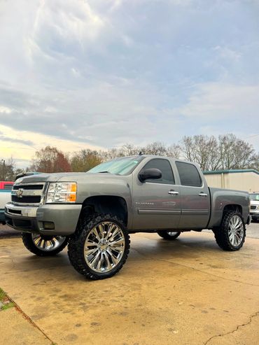 2011 Chevy Silverado with a 7.5" Rough Country Lift sitting on Brand New 26" C37s on 37" Gladiators 
