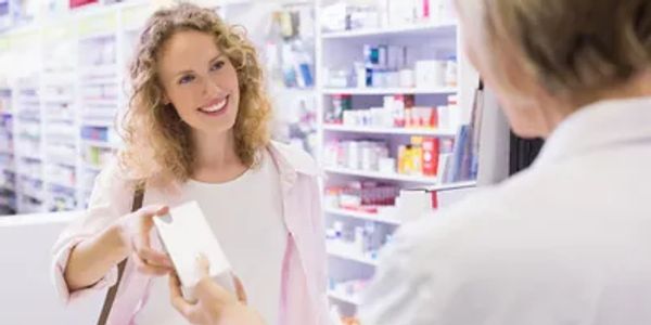Psychiatrist administering medication to patient as part of mental health treatment plan.