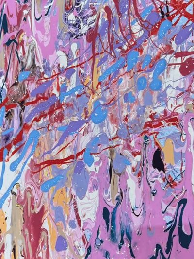 Colorful abstract painting with splashes of pink, blue, red, and purple.