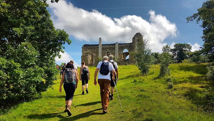 Group hiking in the Surrey Hills up to St. Catherines Chapel.