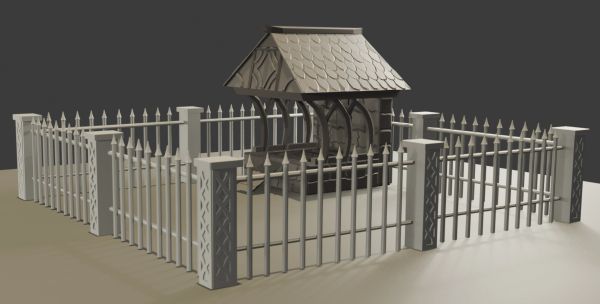 Decorative well surrounded by a metal fence.