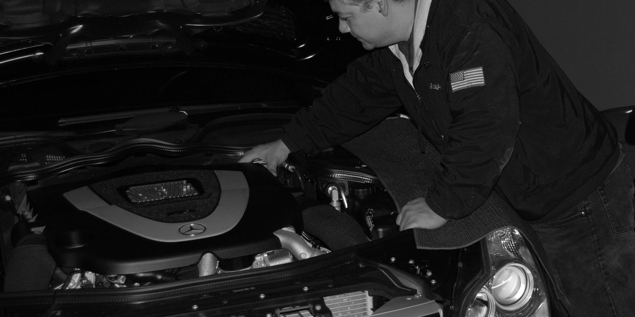 Mechanic Servicing Mercedes Benz Car