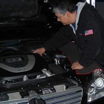 Mechanic Servicing Mercedes Benz Car