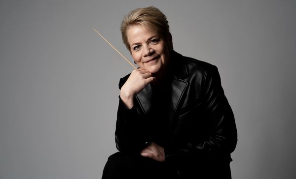 Marin Alsop holds her baton for a promotional image.