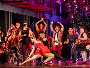 Group of dancers performing in West Side Story Broadway-opera crossover production.