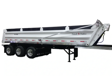 White Canuck Trailers dump trailer with three axles and polished wheels.