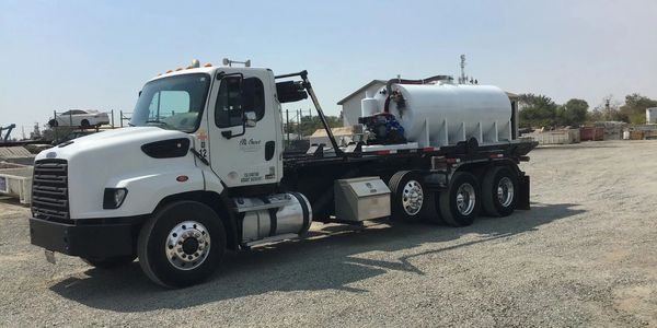 Truck outfitted for vacuuming Service  