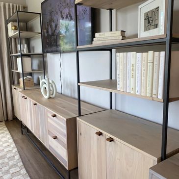 Modern wooden shelving units with books and decor.