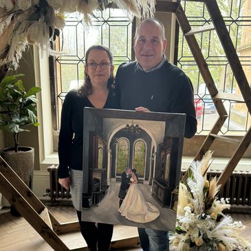 Wedding couple holding finished wedding painting at Cornhill Castle, Biggar - Manorview Hotel. 