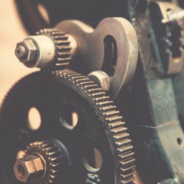 Close-up of mechanical gears and cogs.