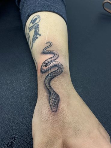 Trigger Jo Austin Texas black and grey tattoos, fine line tattoos, & custom tattoo snake