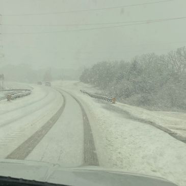 Snow covered roads and power lines