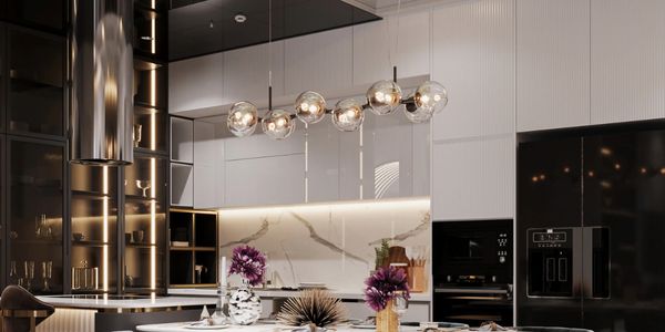 Modern kitchen with elegant dining table and ambient lighting.