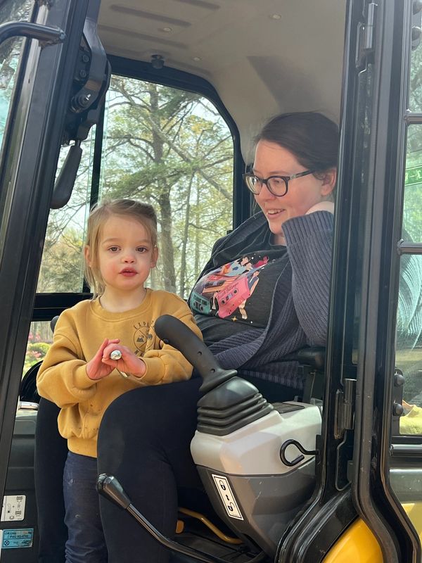 A child in an excavator. 