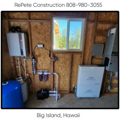 Home water filtration system installed in Big Island, Hawaii. A RePete Construction electrician installs new lighting and wiring for a residential project in Hilo area.