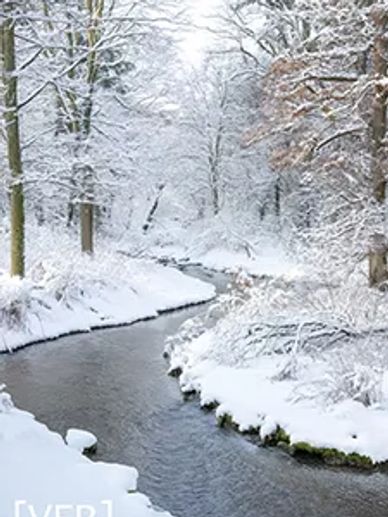 A literary magazine cover featuring a snowy landscape and icy river.