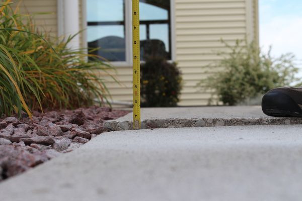 sunken walkway needing polyurethane injection to repair and level it.