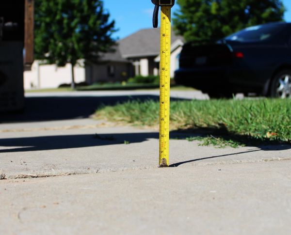 Sidewalk repaired and lifted using polyurethane injection