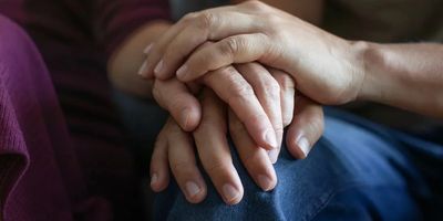 Man and woman holding hands 