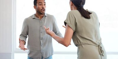 Man and woman arguing with one another 