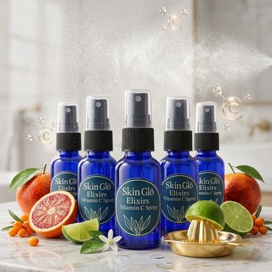 Blue Vitamin C spray bottles with fresh citrus and flowers.