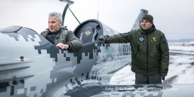 Latvian defence minister Artis Pabriks tests locally produced Tarragon aircraft during winter