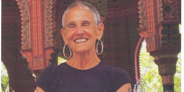 Portrait of happy older woman looking at camera