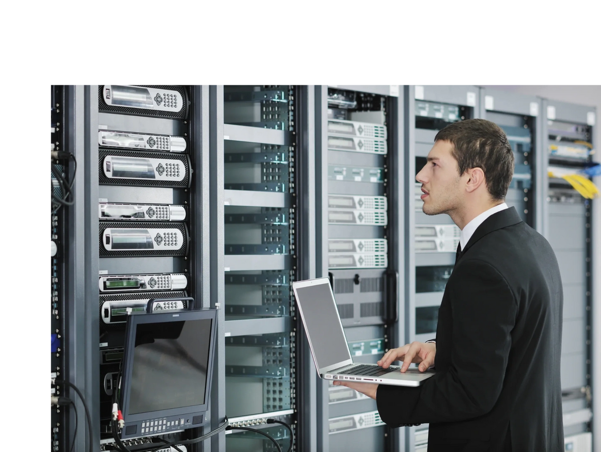 person looking at computers and equipment