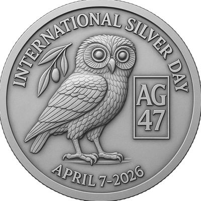 Silver coin commemorating International Silver Day with an owl and date April 7, 2026.