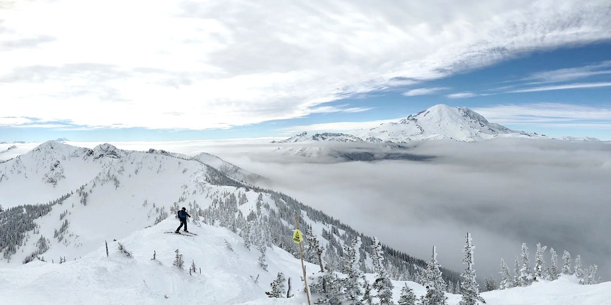 Crystal Mountain Mt. Rainier in Backg. Eric Morrissette charging powder snow ski stories from the NW