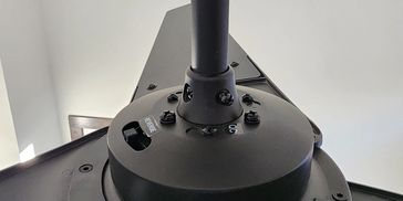 Close-up of a black ceiling fan's motor and blades.