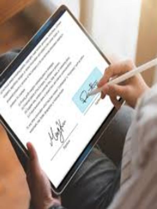 Client signing loan documents on an iPad