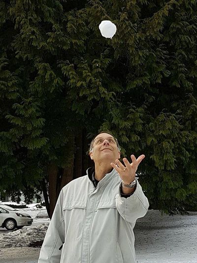 Stewart Cohen. Scientist. Throwing a snowball in the air.