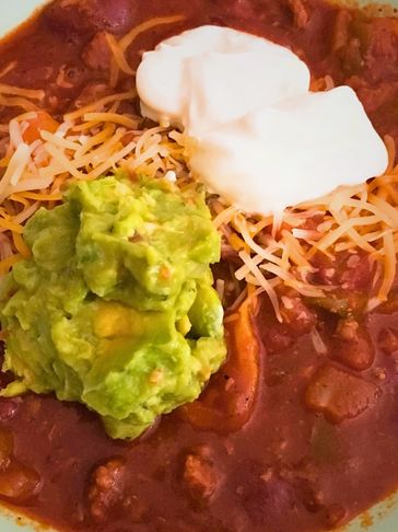 Tacos Tuesdays™ ChiliHelper Chili with Sour Cream, Guacamole and Cheese.