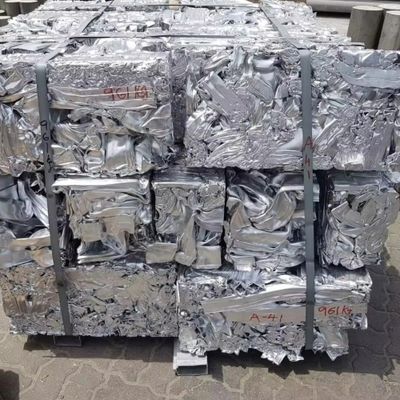 Compressed aluminum scrap bales stacked on a pallet.