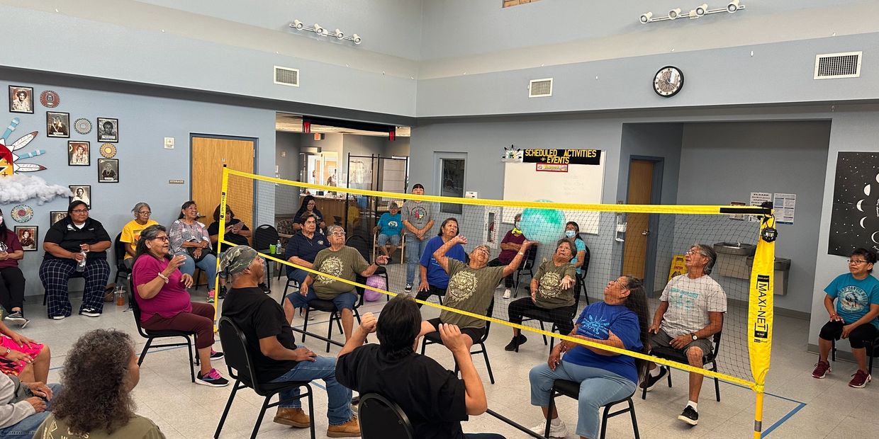 Group of our seniors playing a game of Chair Volleyball.  This game generates a lot of excitement, f