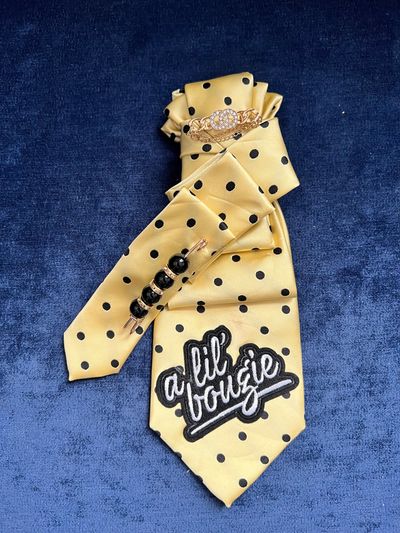 Beautiful yellow and black custom tie with brooch