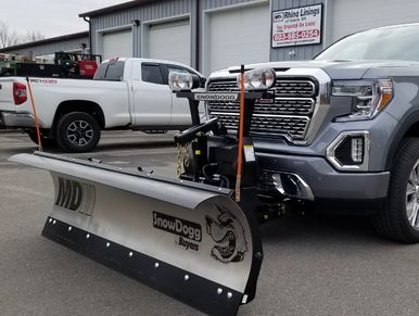 Snowplow installed on a truck.