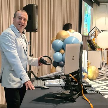 DJ
Professional DJ
Music artist
DJ performance
Live music
Nightclub
Music event
DJ booth
DJ equipment
Turntables
Mixer
Headphones
Club atmosphere
Party
Dance floor
Sound system
Event entertainment
Music industry
DJ lights
DJ setup