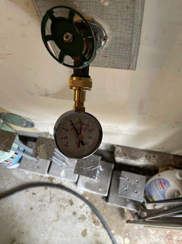 Checking water pressure to a house at hose bib.  