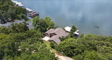 Aerial View of House From Property Across The Street. 